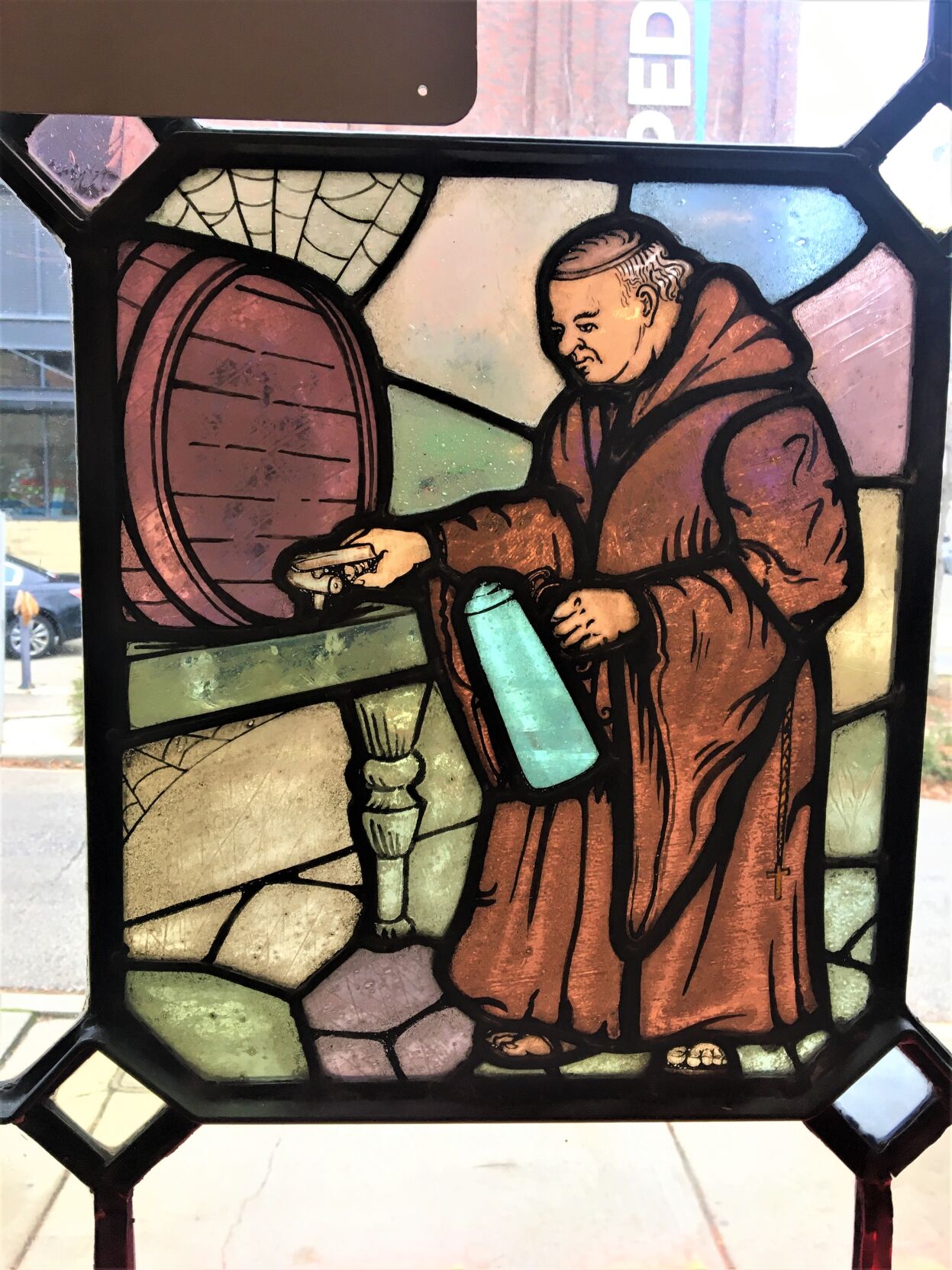 Stained glass window of monk tapping a beer barrel at the historic former Pabst Brewing Co. brewery in downtown Milwaukee